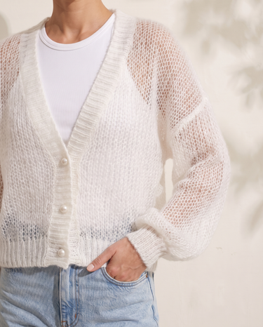 Marisol Knit Cardigan in White, detail of the balloon sleeve, ribbed cuff and hem