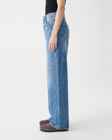 Side profile of Hallie Jeans showing the relaxed wide straight leg and raw hems