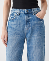 Close-up of Hallie Jeans worn with a black rib tank, showing the vintage blue wash, button and front pockets