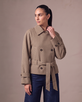 Lorelai Trench Coat in brown check — front view, short double-breasted coat with a self-tie belt, worn over dark indigo wide-leg jeans