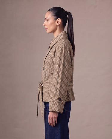 Lorelai Trench Coat in brown check — side profile showing the hip-length cut and belt tie