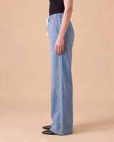 Isla Stretch Denim Jeans, side view showing the wide-leg drape