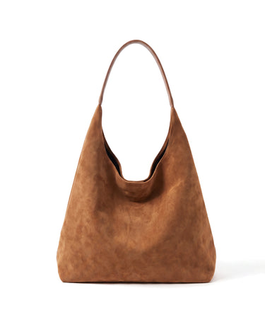 The Léa Slouch Tote in brown suede, front view on a pure white studio background