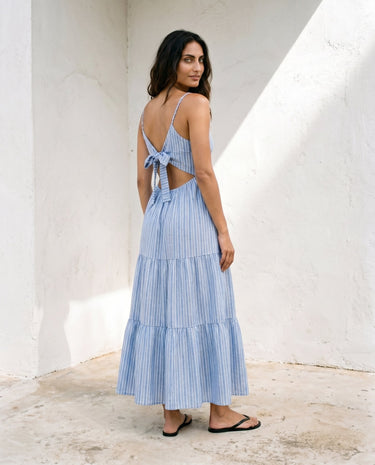 Isla Striped Summer Maxi Dress in blue stripe — maxi dress with tie-back detail, back view on model