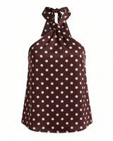 Isola Halter Neck in brown polka dot — halter top with a knotted neck tie and open back, flat-lay