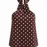 Isola Halter Neck in brown polka dot — halter top with a knotted neck tie and open back, flat-lay
