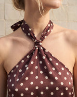 Isola Halter Neck in brown polka dot — close-up of the knotted halter neckline