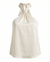 Isola Halter Neck in white — halter top with a knotted neck tie and open back, flat-lay