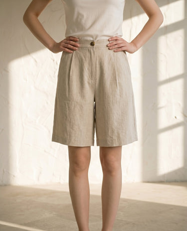 Linen-colour tailored shorts on model, front view – Moriel Heritage
