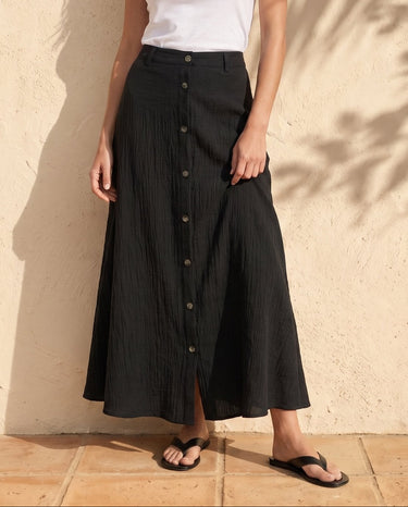 Kyra Flow A Line Skirt in black — button-front A-line maxi skirt, front view on model