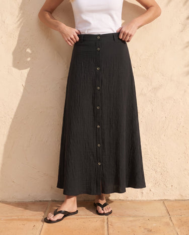 Kyra Flow A Line Skirt in black — close-up of waistband and front button placket