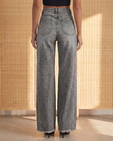 Back view of the gray Langley Wide Leg Jeans showing the patch back pockets and the wide straight leg falling to a frayed hem