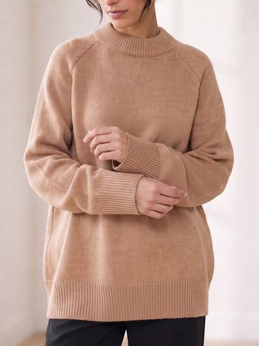 The Lauria wool blend knit sweater in camel — front view on model