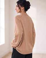 The Lauria wool blend knit sweater in camel — back view on model