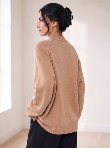 The Lauria wool blend knit sweater in camel — back view on model