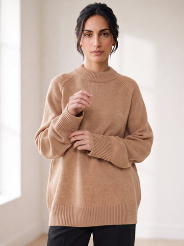 The Lauria wool blend knit sweater in camel — front three-quarter view on model