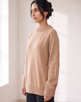 The Lauria wool blend knit sweater in camel — side view on model