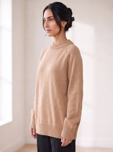 The Lauria wool blend knit sweater in camel — side view on model