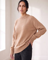 The Lauria wool blend knit sweater in camel — side view on model