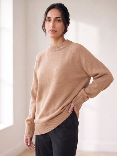 The Lauria wool blend knit sweater in camel — side view on model