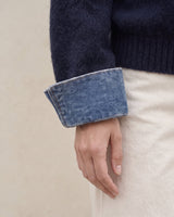 Leonie Denim Knit — close-up of turn-back denim-look cuff on the soft navy knit sleeve