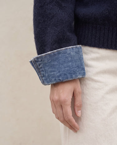Leonie Denim Knit — close-up of turn-back denim-look cuff on the soft navy knit sleeve