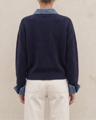 Leonie Denim Knit in navy — back view on model showing ribbed hem and denim-look cuffs
