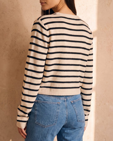 The Lilah cotton stripe cardigan in black stripes — back three-quarter view on model