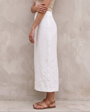 White midi skirt on model, arms crossed front view – Moriel Heritage