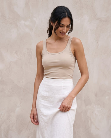 White midi skirt on model, relaxed front view – Moriel Heritage