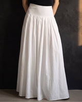 Lolie Skirt in white — front view on model, styled with a black top