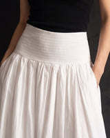 Lolie Skirt in white — close-up of the wide shirred waistband and side pockets