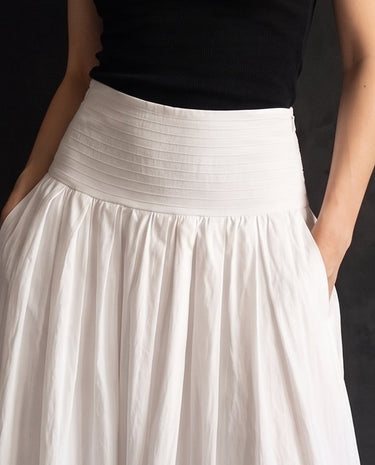 Lolie Skirt in white — close-up of the wide shirred waistband and side pockets