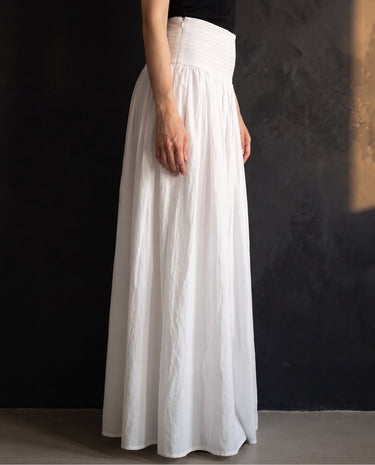 Lolie Skirt in white — side view showing the full sweep of the skirt
