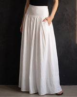 Lolie Skirt in white — front view with hands in the side pockets