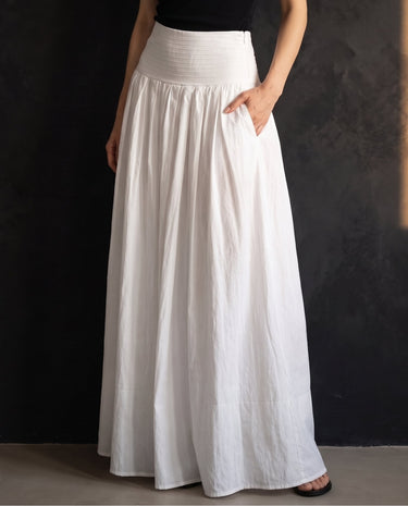 Lolie Skirt in white — front view with hands in the side pockets