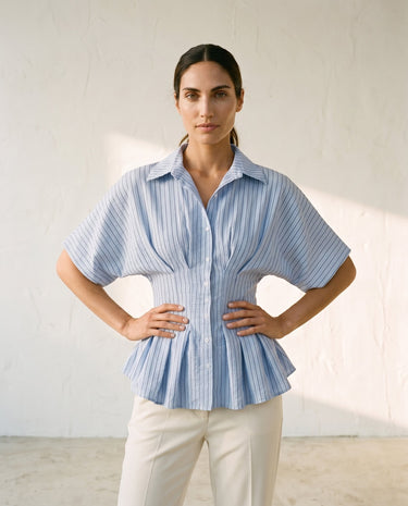 Blue striped Lori top on model, hands on hips – Moriel Heritage