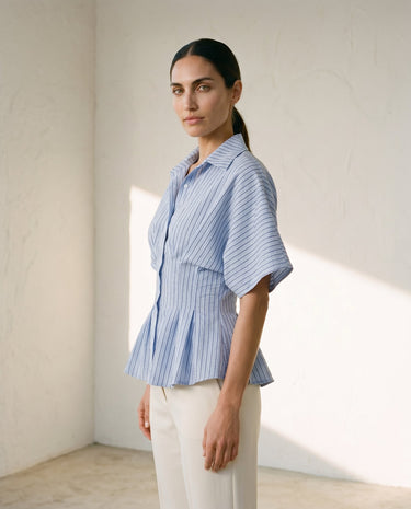 Blue striped Lori top on model, side view – Moriel Heritage