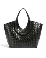The Lucca Woven Tote in black, front view on a pure white studio background showing the basketweave body and curved handles