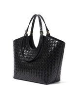 The Lucca Woven Tote in black, studio hero view showing the flared shopper silhouette and gold-tone handle keepers