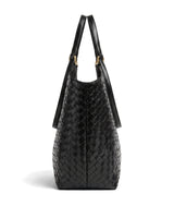 The Lucca Woven Tote in black, side profile view showing the tapered base