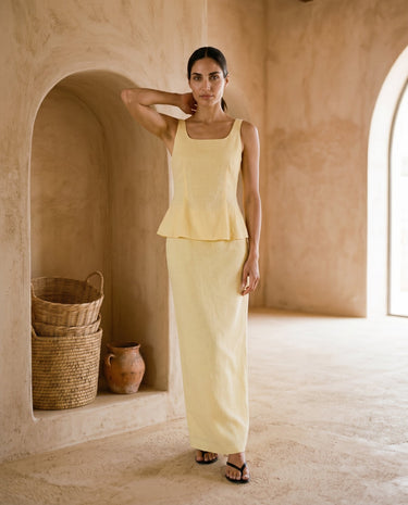 Yellow strap top and fishtail skirt set on model, hand raised – Moriel Heritage