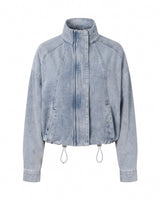 Marbella Denim Jacket — cropped light-wash denim jacket with stand collar and drawcord hem, flat lay