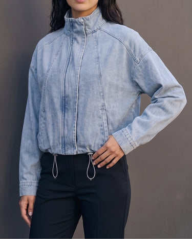 Marbella Denim Jacket — three-quarter front view on model, hand on hip