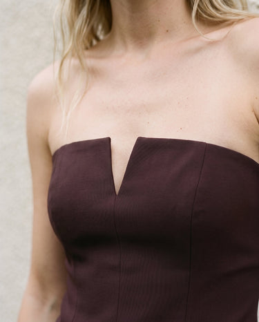 Close-up of the brown top's notched V neckline and centre seam – Moriel Heritage