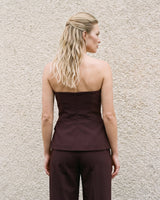 Back view of the brown structured strapless top showing the fitted straight back – Moriel Heritage