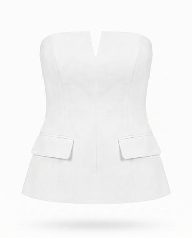 White structured strapless top with notched V front and flap pockets, flat lay – Moriel Heritage