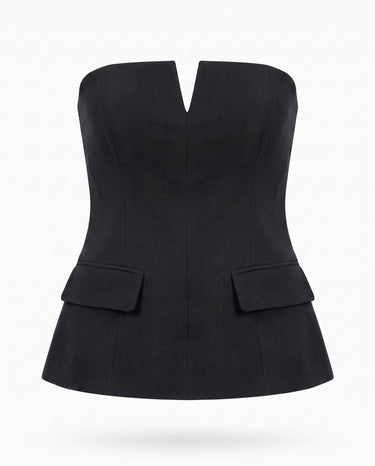 Black structured strapless top with notched V front and flap pockets, flat lay – Moriel Heritage