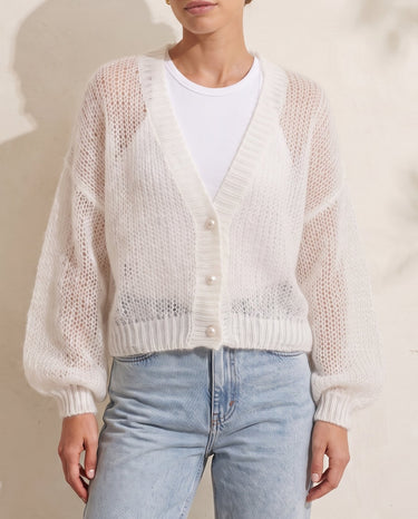 Marisol Knit Cardigan in white — open-knit cardigan over a white tank with light-wash jeans, front view on model