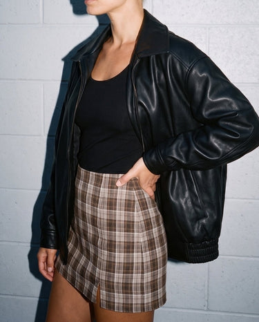 Side view of the black Marseille Faux Leather Jacket showing the relaxed oversized fit